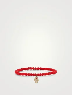 Coral Beaded Bracelet With Gold Ruby And Diamond Hamsa Charm