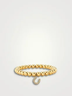 Gold Beaded Bracelet With Small Gold Bezel Diamond Horseshoe Charm